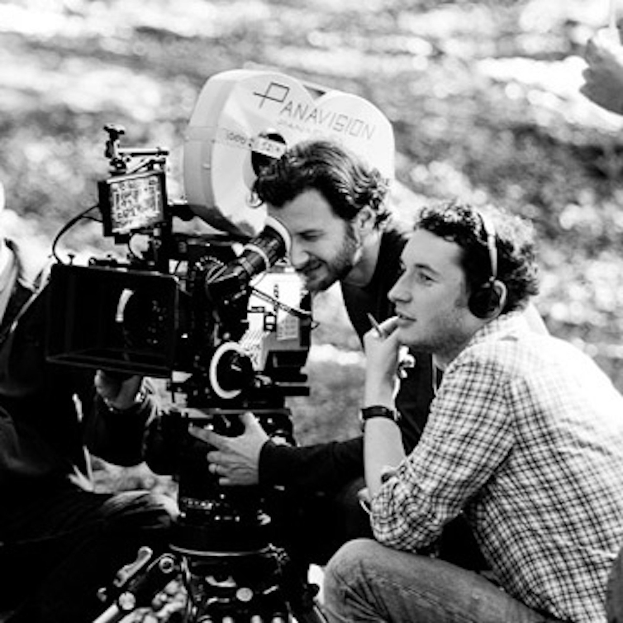 Two students work behind a camera