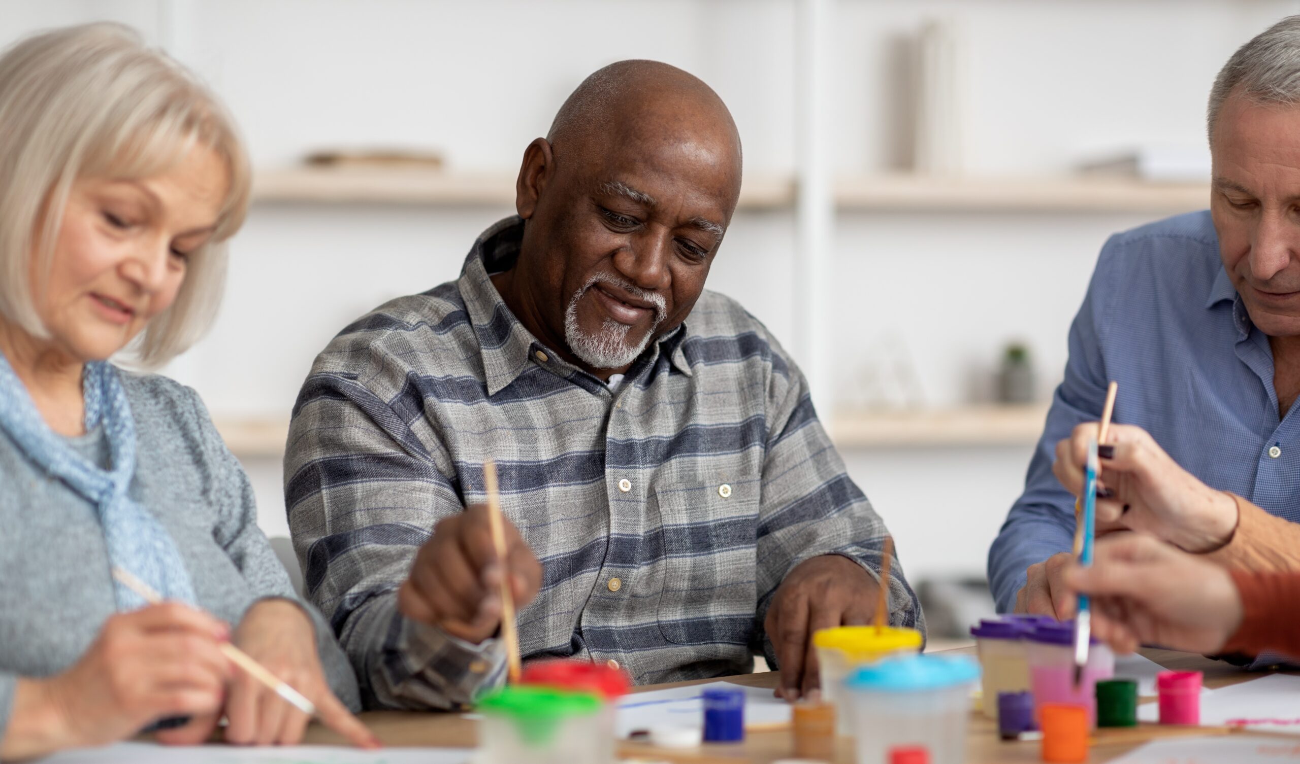 Three people painting