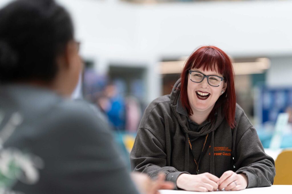 A careers coach talks to a student.